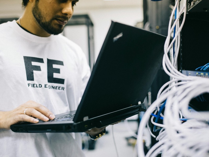 Image of a worker programming a system
